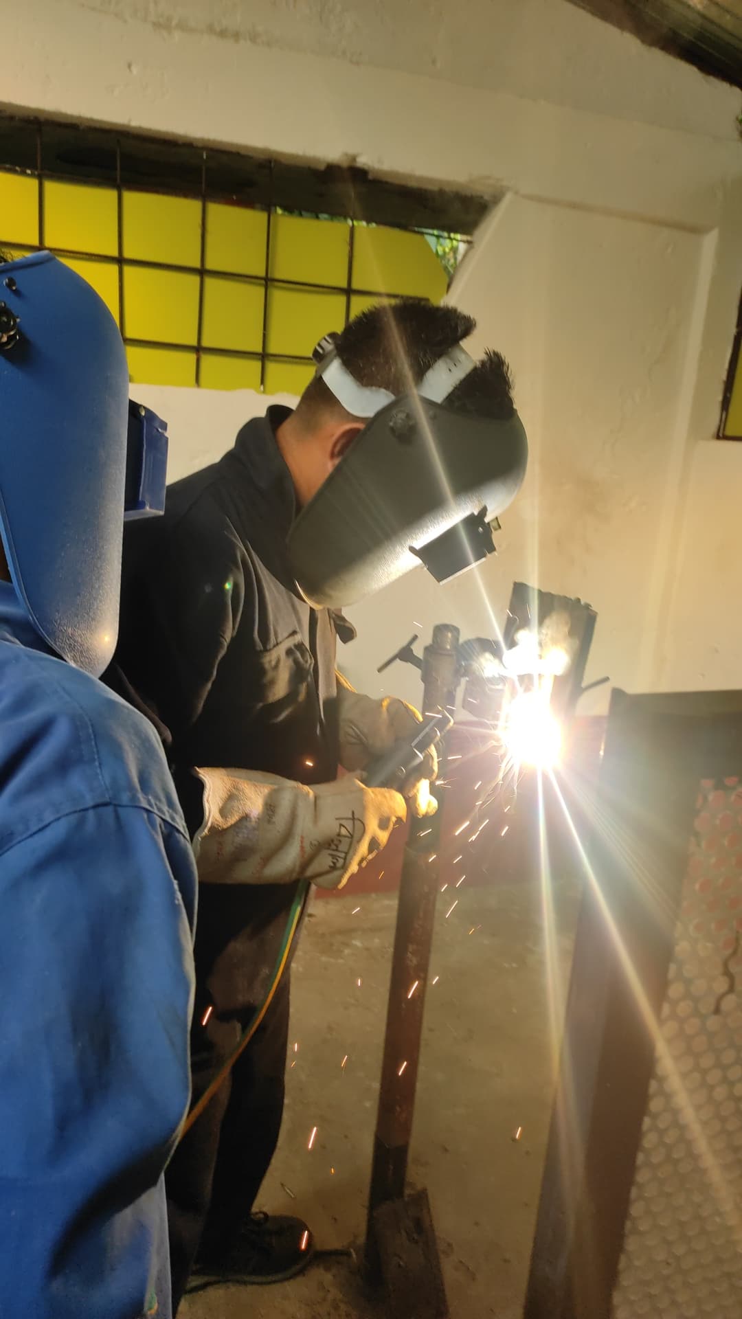 Student learning welding techniques