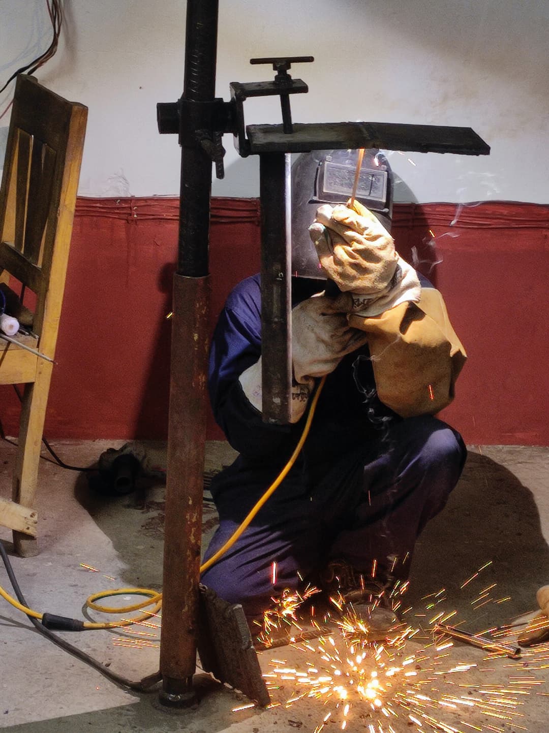 Student completing welding project